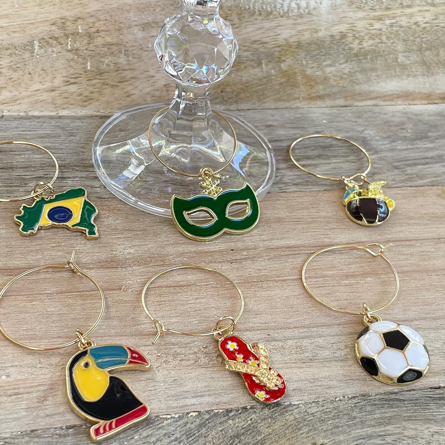 Brazilian Wine Charms on a wood surface.