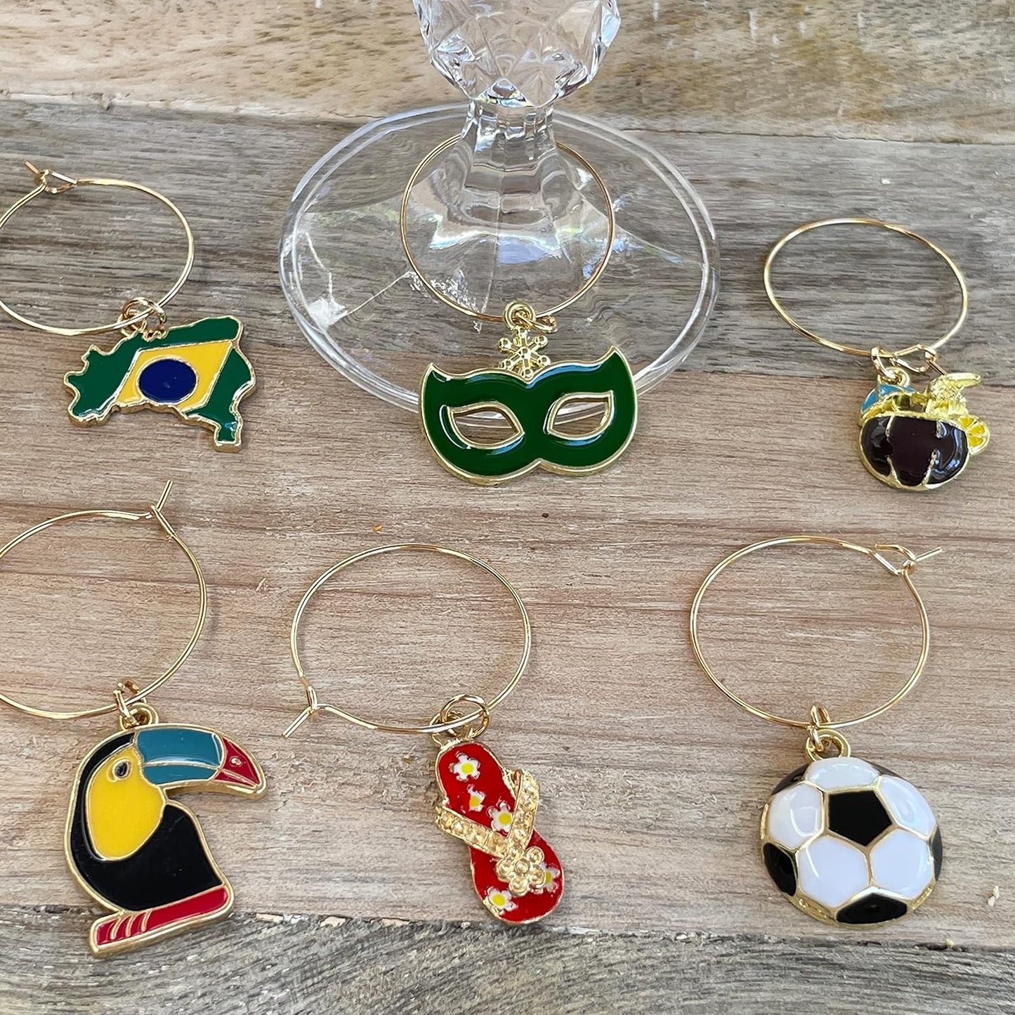 Brazilian Wine Charms on a wood surface.