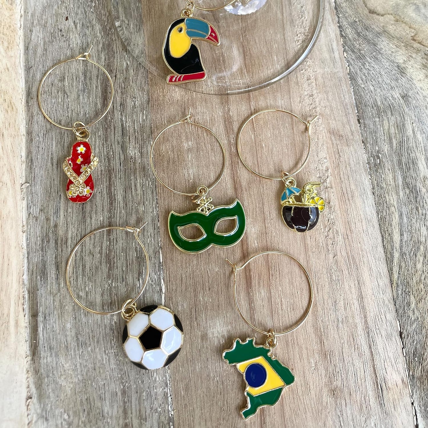 Brazilian Wine Charms on a wood surface.