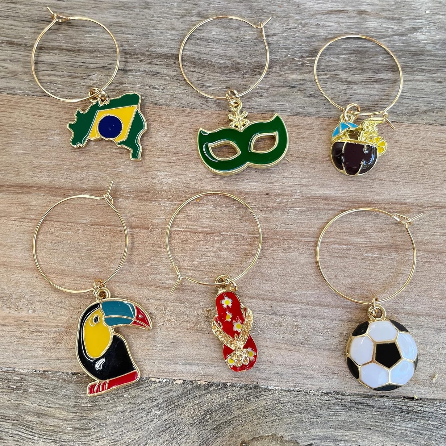 Brazilian Wine Charms on a wood surface.