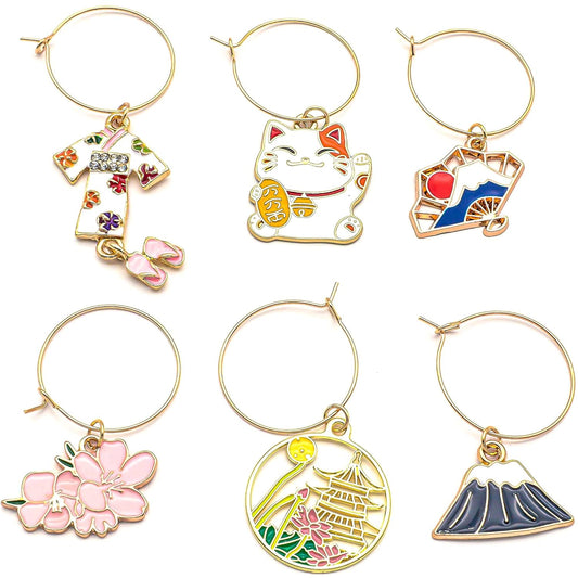 A set of Japanese Wine Charms on a white surface.