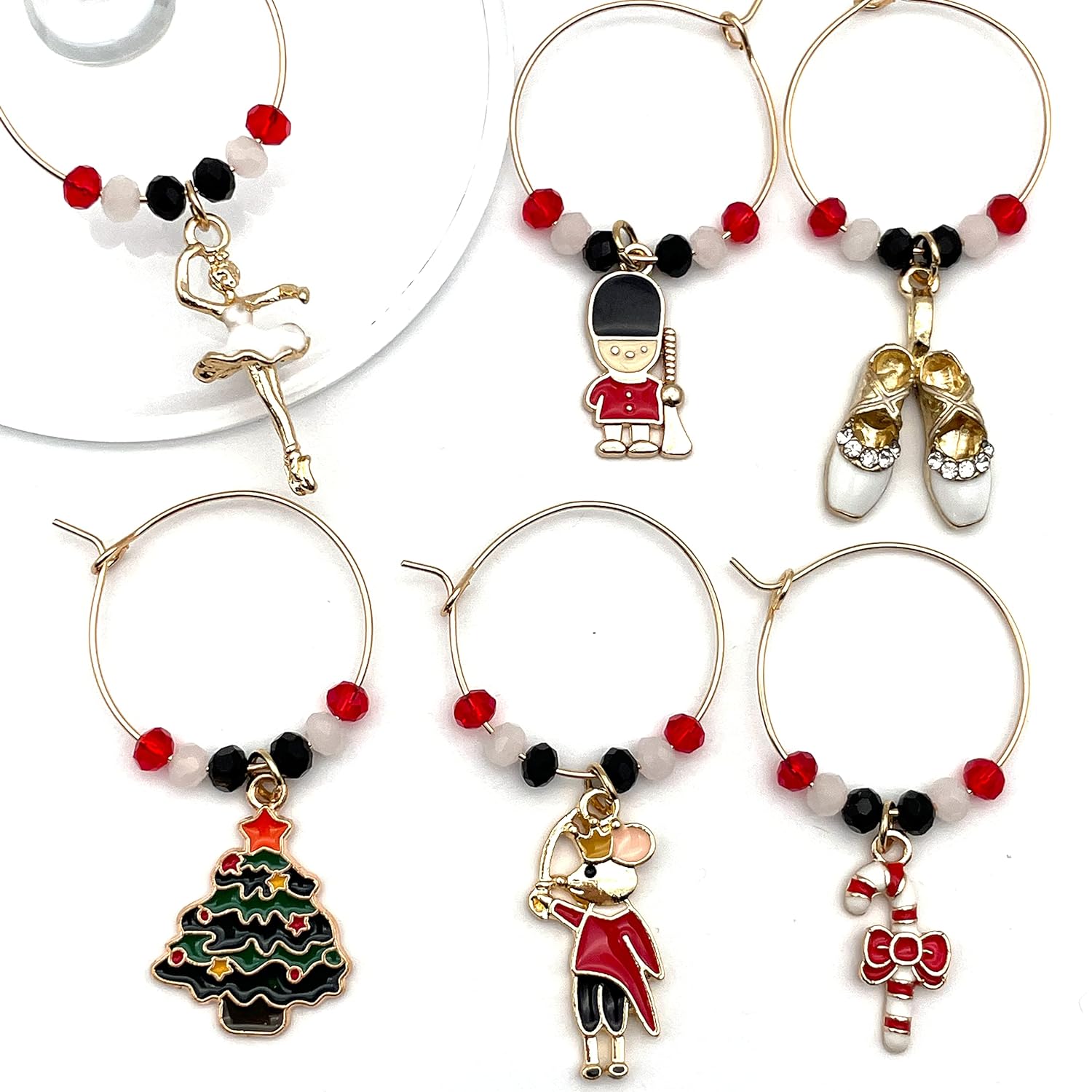 Nutcracker Wine Charms on a white surface.