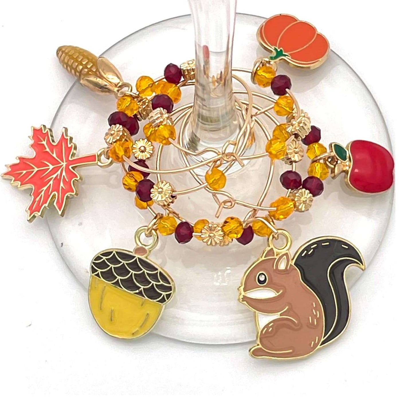 Thanksgiving Wine Charms hooked on the glass.