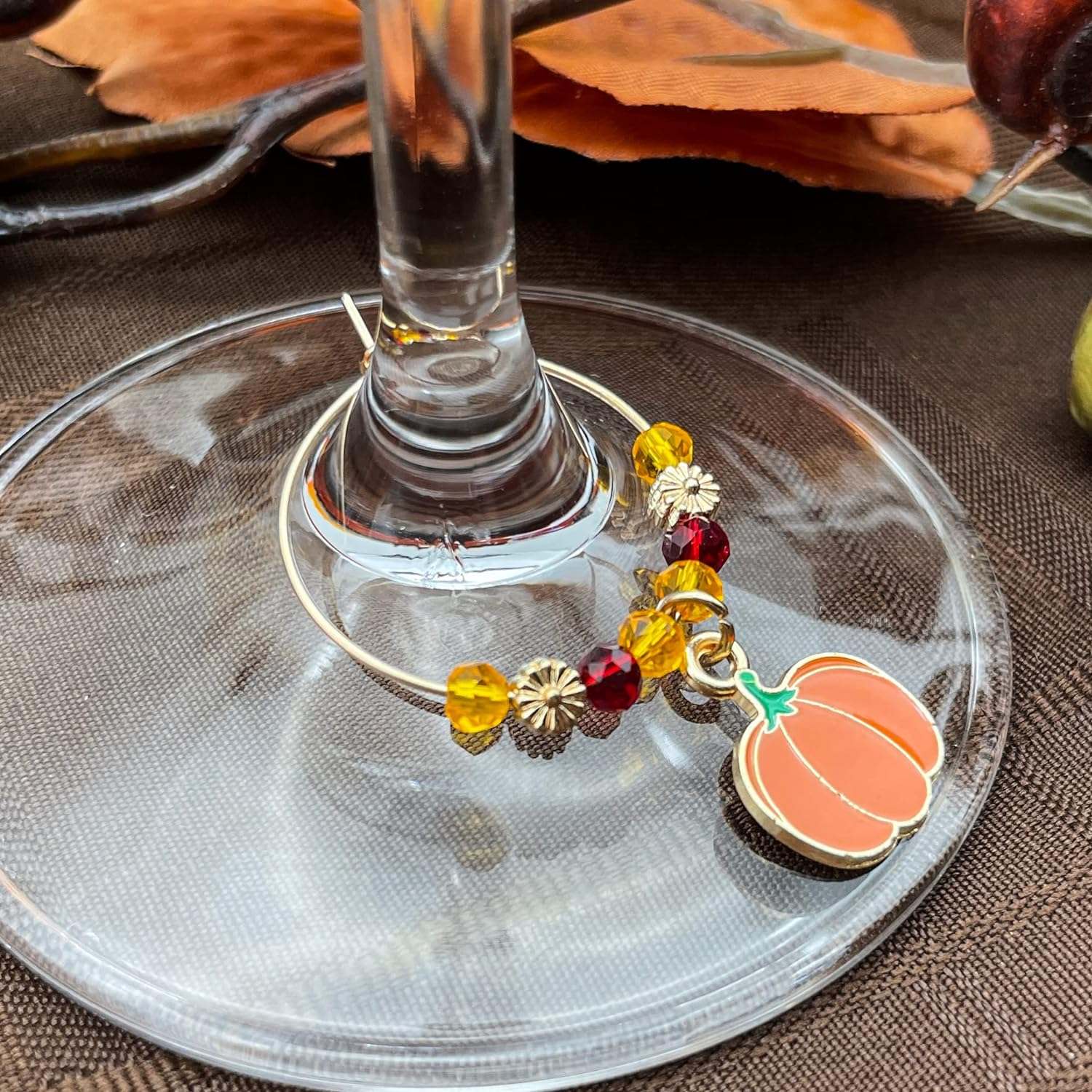 Thanksgiving Wine Charms hooked on the glass.