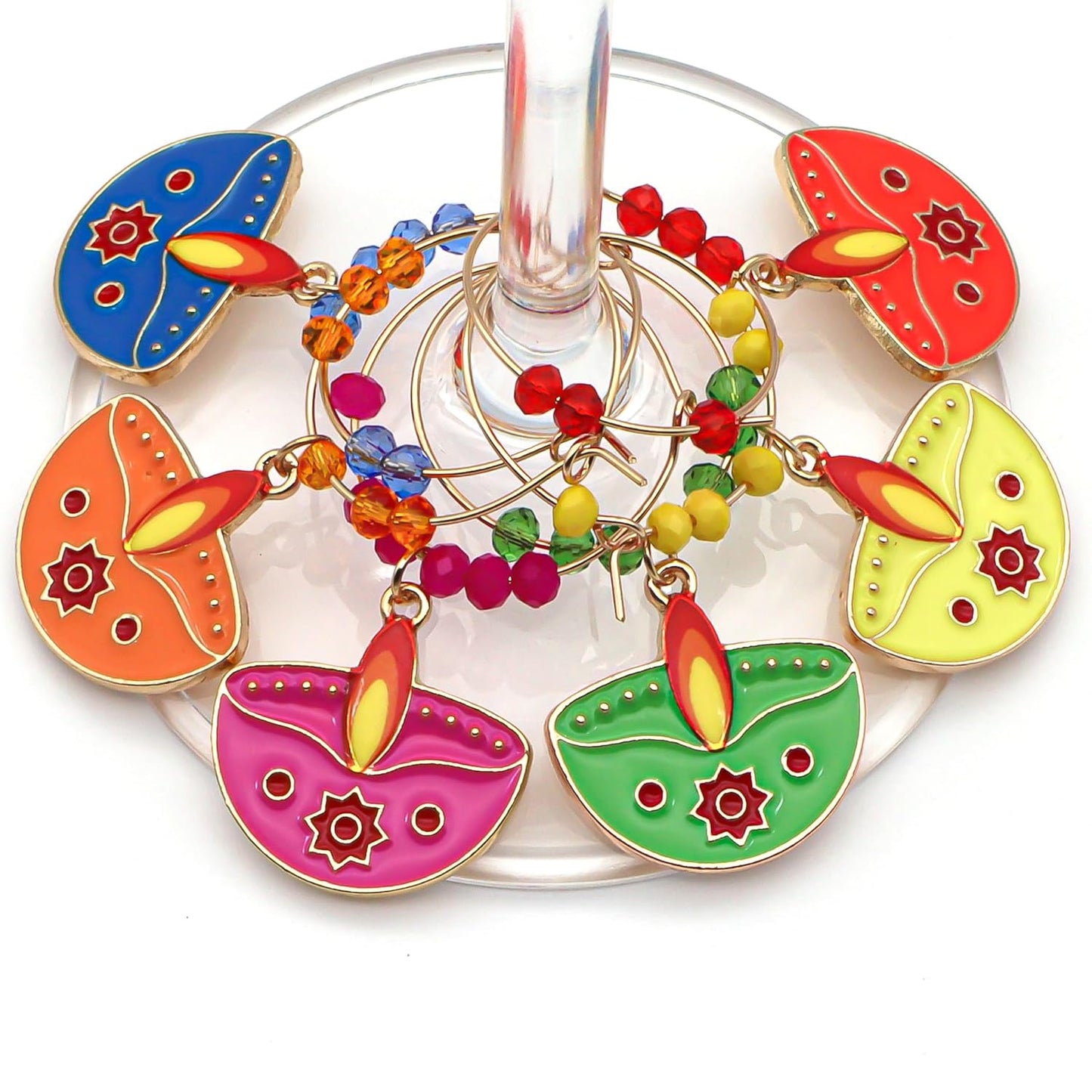 A colofrul set of Diwali Wine Charms hooked on the wine glass.