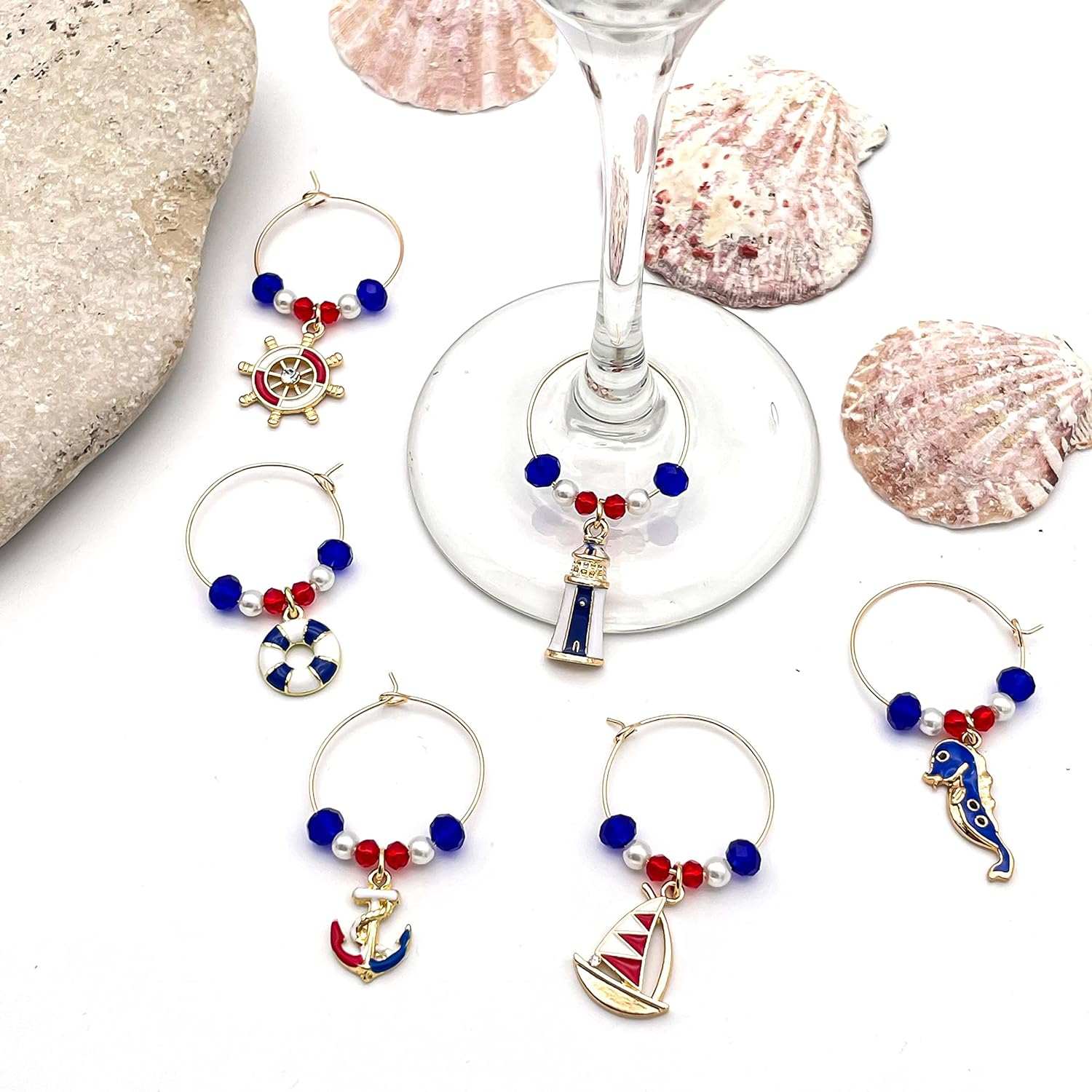 Nautical Wine Charms with Shells on a white surface