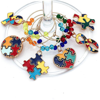 Autism Awareness Glass Charms feature puzzle piece designs that hook onto the glass