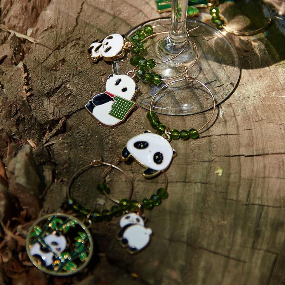 Panda Wine Charms on a wood surface