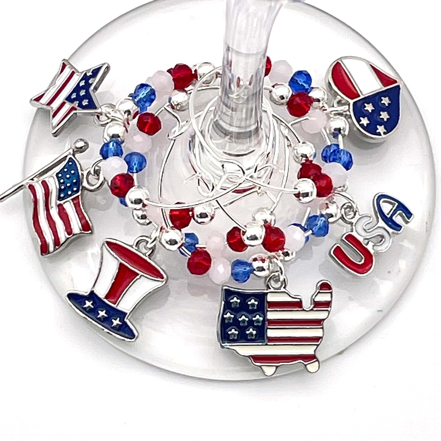 USA Wine Charms hooked on the glass.