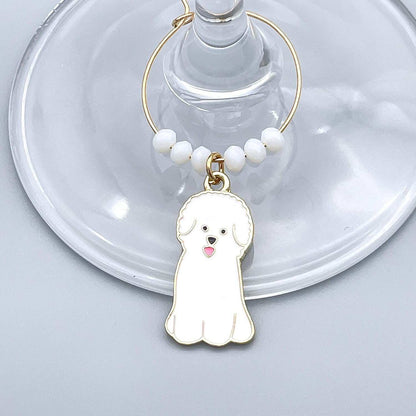 White Colored Maltese Dog Wine Charms hooked on the wine glass.