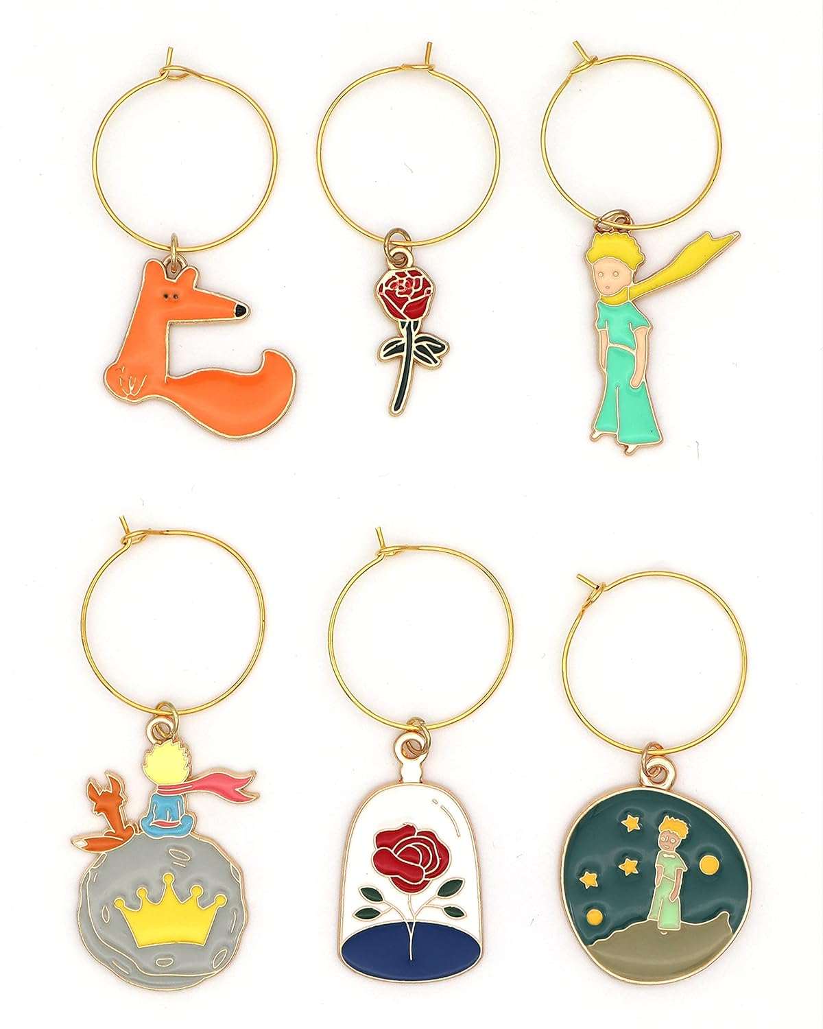 The Little Prince Wine Charms on a white surface.