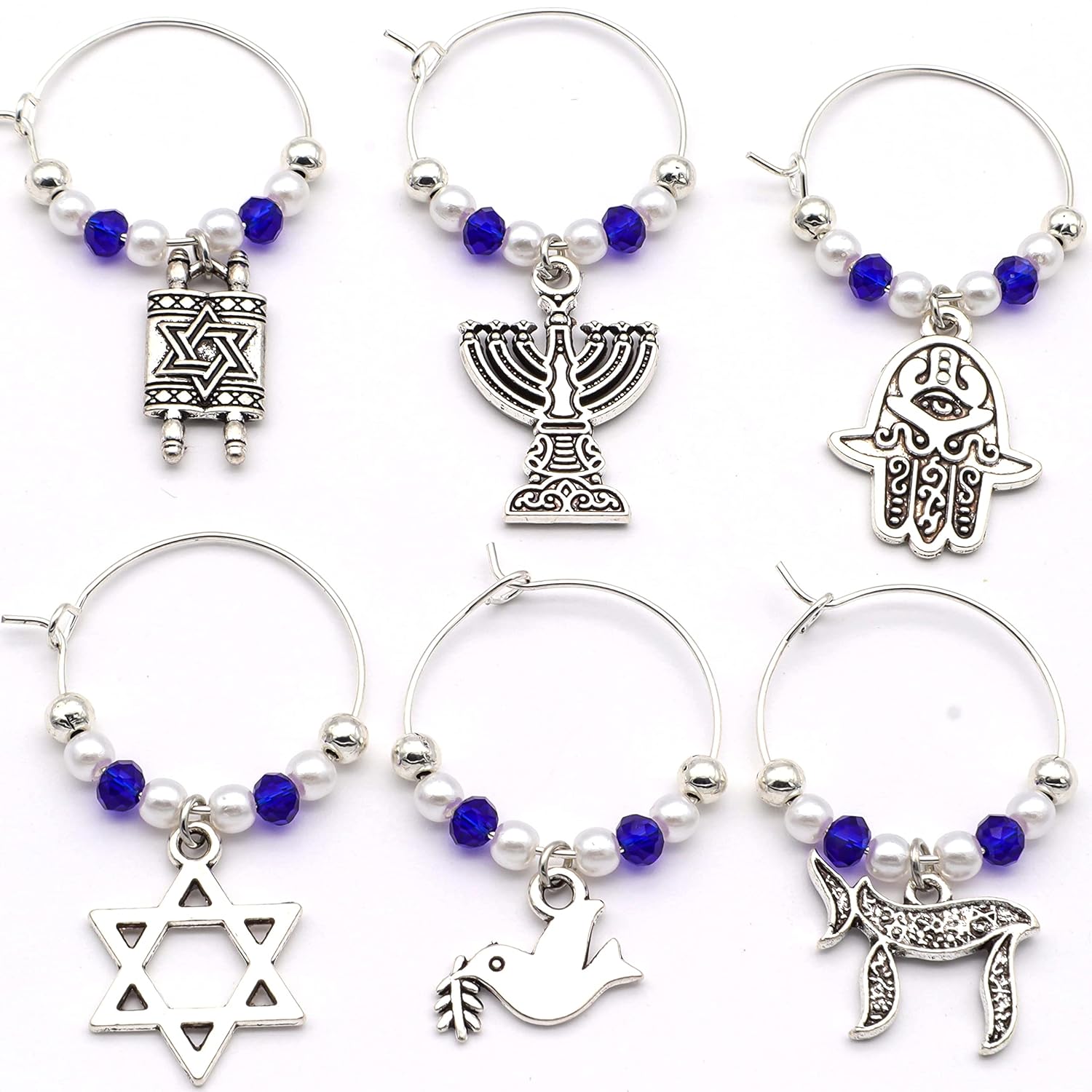 Jewish Wine Charms on a white surface.