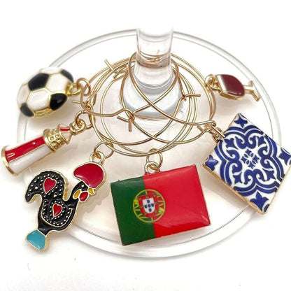 Colorful set of Portugal Wine Charms hooked on the glass.