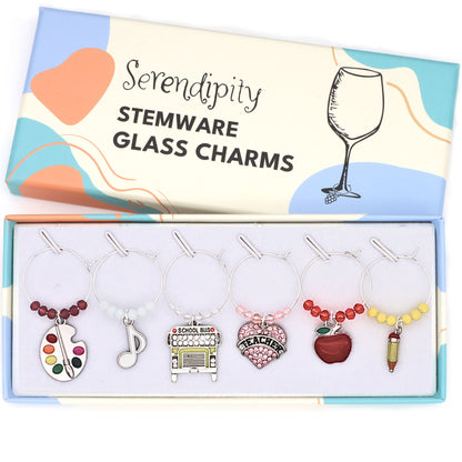 A set of Favorite Teacher Wine Glass Charms on the brand's box. 