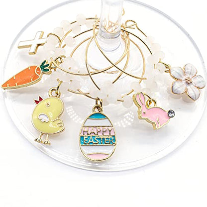 A set of Easter Wine Charms featuring Bunny, Egg, Cross, Carrot, Chick, and Daisy hooked on the glass.