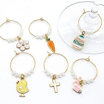 A set of Easter Wine Glass Charms featuring Bunny, Egg, Cross, Carrot, Chick, and Daisy on a white surface.