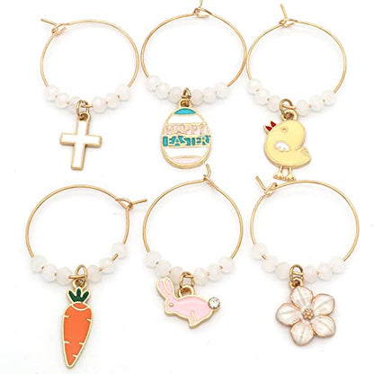 A set of Easter Wine Glass Charms featuring Bunny, Egg, Cross, Carrot, Chick, and Daisy on a white surface.