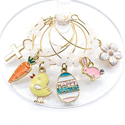 A set of Easter Wine Charms featuring Bunny, Egg, Cross, Carrot, Chick, and Daisy hooked on the wine glass.
