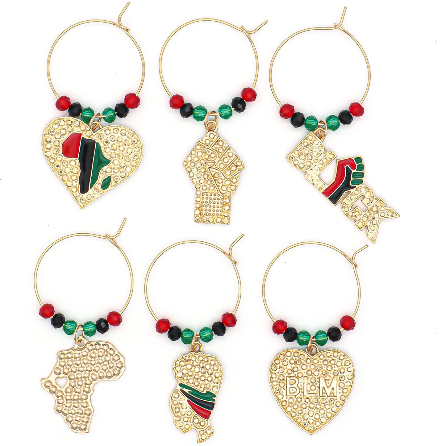 Africa Wine Charms on a white surface representing Pan-African Flag, a map of the African continent, a Heart with "BLM" engraved, a Girl wearing an African headwrap, a Clenched Fist, and the Black Power Symbol.